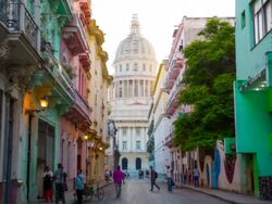 Street scene in Havana / Cuba with Capitolio in the Background Stock Footage