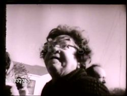 1960s: AFRICA-AMERICAN CIVIL RIGHTS MOVEMENT: VS Group of white women attacking black female on street, police officers breaking up fight, white protestors speaking to reporters, elderly female knocking camera. Racism, racial discrimination, hate Instructional Video