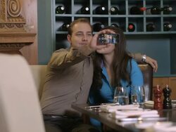 MS Businessman and businesswoman discussing with digital tablet in restaurant Stock Footage