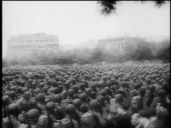 B/W August, 1944 high angle REAR VIEW crowd of soldiers marching in formation / Paris liberation / doc. Stock Footage