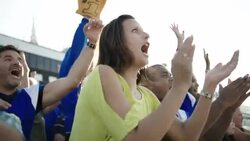 Anxious stadium crowd cheers at football game Stock Footage