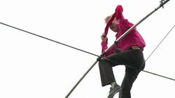 CLEAN : Tightrope walker Denis Josselin crosses Seine on 175 metre wire News Clip