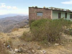 R-L Pan from hilltop building to Oruro mountain ranges, Bolivia Stock Footage