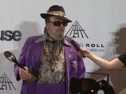 SPEECH: Dr. John jokes that he gets his shoes at the pimp store.  Stock Footage