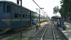 A diesel passenger train with packed carriages idles in a station in Northern Bangladesh before beginning a long journey to Dhaka Stock Footage