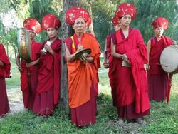 Buddhist monks playing instruments at a local ceremony, Punakha, Bhutan, Asia Stock Footage