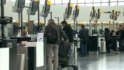 Passengers Checking In at Heathrow Airport News Clip