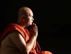 Buddhist monk praying Stock Footage