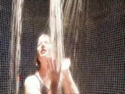 CU young woman in pool showers Stock Footage