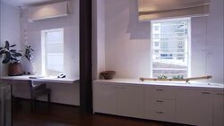 Cabinets line a hotel room with modern decor. Stock Footage