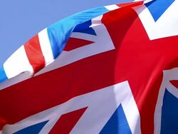 CU SLO MO Shot of British Flag Waving in Wind / Caen, Normandy, France Stock Footage