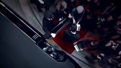 Celebrity couple step out of limousine and sign autographs for fans on red carpet at awards show Stock Footage