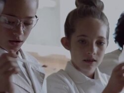 CU School teacher assisting children in science lab Stock Footage