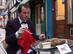 ARTIST EATS CORGI IN PROTEST OF PRINCE PHILIP Stock Footage