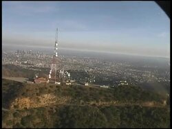 Downtown Los Angeles Behind Hollywood Hills: from LAPD Police Helicopter Stock Footage