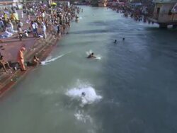 WS ZI Boy diving into Ganges from overhead bridge at hari ki Pauri / Haridwar, Uttarakhand, India Stock Footage