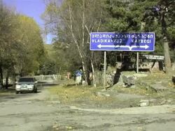 MS ZO Shot of sign post in Stepantsminda village, showing way to vladikavkaz / Stepantsminda, Kazbegi, Georgia  Stock Footage