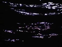 Light reflects off waves rolling across water. Stock Footage