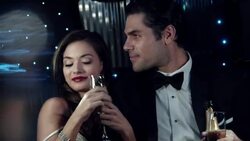 Hollywood couple clink champagne glasses and gaze out at paparazzi, young starlet's strap slips off her shoulder at awards show Stock Footage