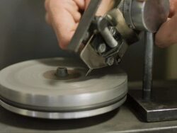 CU jeweller sharpening an engraving needle Stock Footage