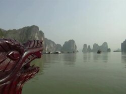 WS Dragon bow of tourist boat with port on Ha Long Bay in background / Quang Ninh , Vietnam Stock Footage