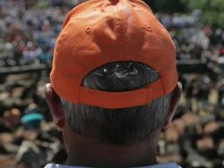 C/U Head of man with baseball cap with his back to us,  watching the rapa  Stock Footage