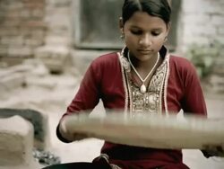 Real people from rural India: Teenage girl winnowing wheat grains. Stock Footage