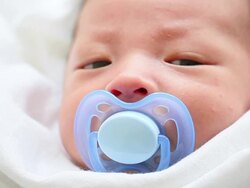 cute asian baby with pacifier Stock Footage