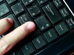 Typing fingers push notebook.Enter Stock Footage