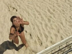 HD Super Slow-Mo: Female Beach Volleyball Player Serving Ball Stock Footage