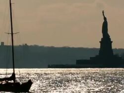 WS View of sail boat crossing  in front Statue of Liberty / New York City, New York, USA  Stock Footage