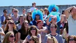 MS Crowd of football fans in stadium doing the wave Stock Footage