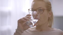 Woman drinking water Stock Footage