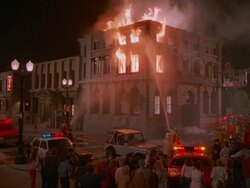 WS Fire fighters putting at burning building at night / Unspecified Stock Footage