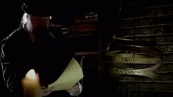 Nostradamus compares the writings on a parchment to a metal globe. Stock Footage