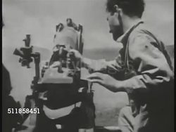 1944: BATTLE OF SAIPAN: MS BEHIND US Marines firing artillery. US Tank firing. CU US Marines firing artillery, soldier discarding shell. HA (SOFT) Shells exploding in open field. WWII, Pacific Theater. Instructional Video