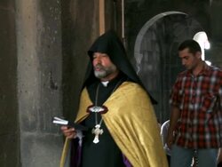 MS People and father come out from church  / Armenia Stock Footage