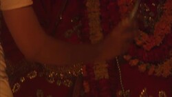 A man performs a religious ritual at a Hindu shrine. Stock Footage