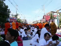 Many people give food and drink for alms to 1,536 Buddhist monks Stock Footage