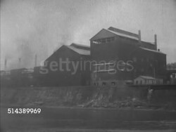 1952: MONONGAHELA RIVER: VS Captain Bill Cunningham navigating the Shannopin diesel towboat from pilot, passing various steel mills, factories, smoke stacks along riverbank. Instructional Video