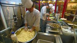Chefs prepare food in a restaurant kitchen. Stock Footage
