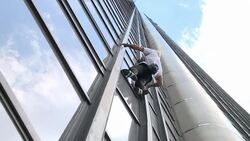 CLEAN : French spiderman climbs Paris tower for Nepal victims News Clip
