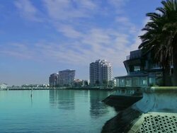 MS Beacon cove lighthouse and apartment buildings on Port Phillip Bay / Melbourne, Victoria, Australia Stock Footage