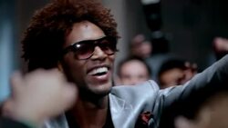 Hip-hop star on red carpet waves to fans and soaks up applause at awards show Stock Footage