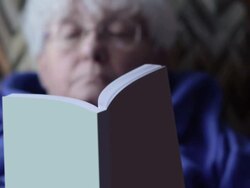 Old woman reading a book Stock Footage