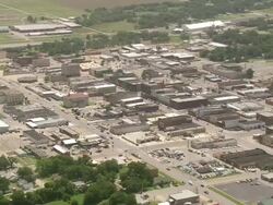 WS AERIAL ZI Traffic moving on high street through Chikashee town / Oklahoma, United States Stock Footage