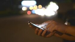 HD:Woman touching smartphone at night time Stock Footage