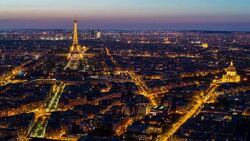 Elevated view of the Eiffel Tower, city skyline and La Defence skyscrapper district in the distance, Paris, France, Europe - Time lapse Stock Footage