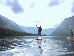 Father And Son SUPing On The Lake Stock Footage