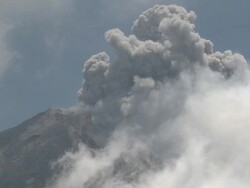 Zoom into eruption of ash from top of Merapi volcano; Central Java, Indonesia. 29 October 2010 Stock Footage